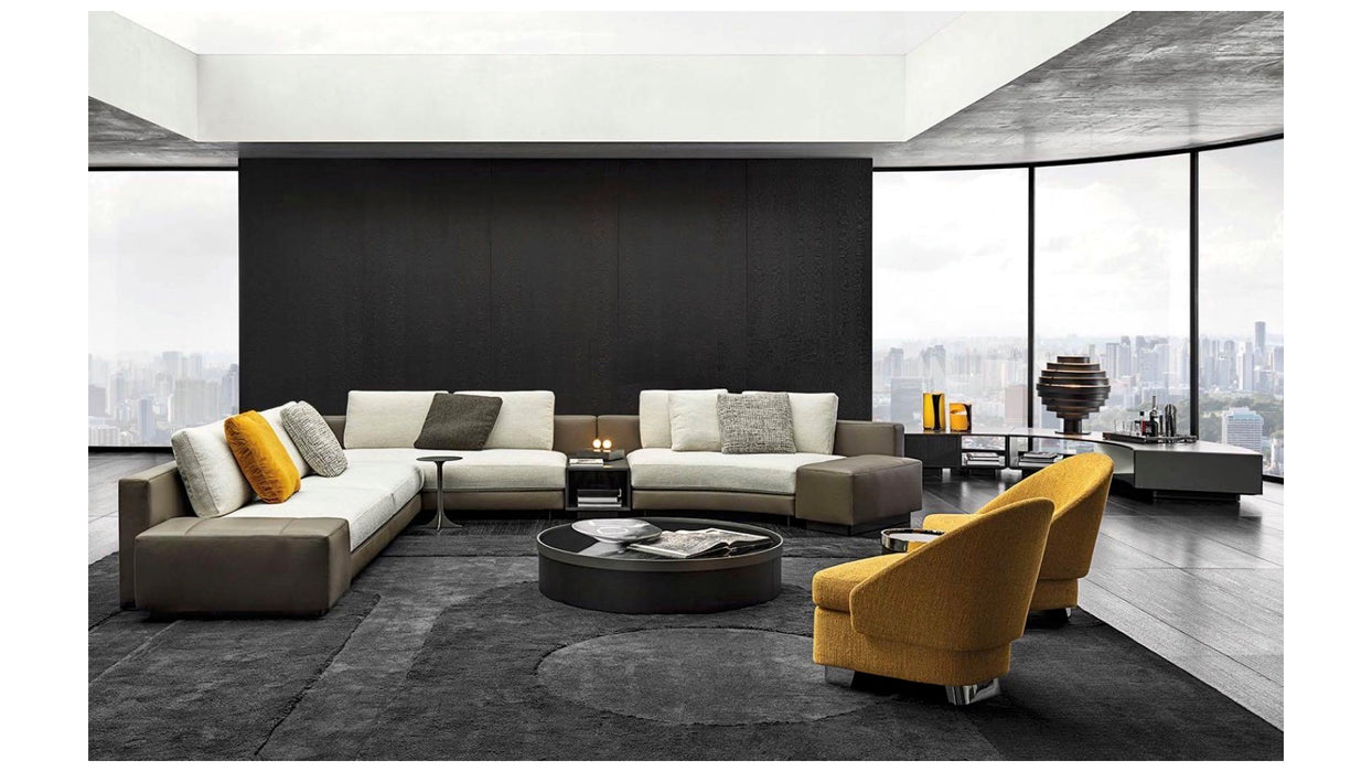 Modern living room with a sectional sofa, armchairs, and a coffee table.