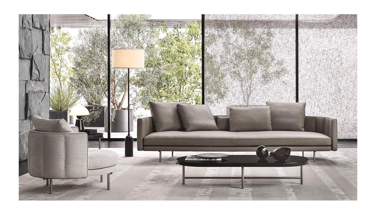 Modern living room with a gray sofa and armchair, coffee table