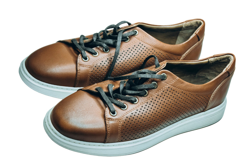 Thomas & Vine men's brown leather perforated low-top sneakers with a white sole and grey laces.