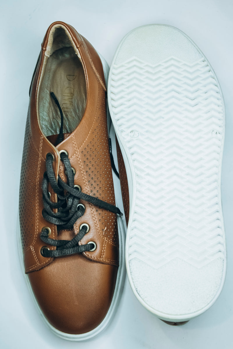 Thomas & Vine men's brown leather perforated low-top sneakers with a white sole and grey laces.