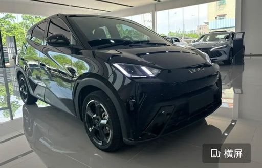 Black SUV in a showroom with reflective floor