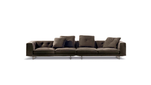 Dark gray sofa with tufted backrests on a white background
