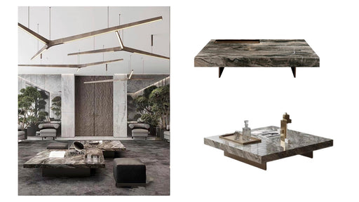 Modern ceiling light fixture and marble table with decorative items in a stylish interior setting.
