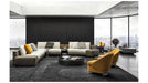 Modern living room with a sectional sofa, armchairs, and a coffee table.