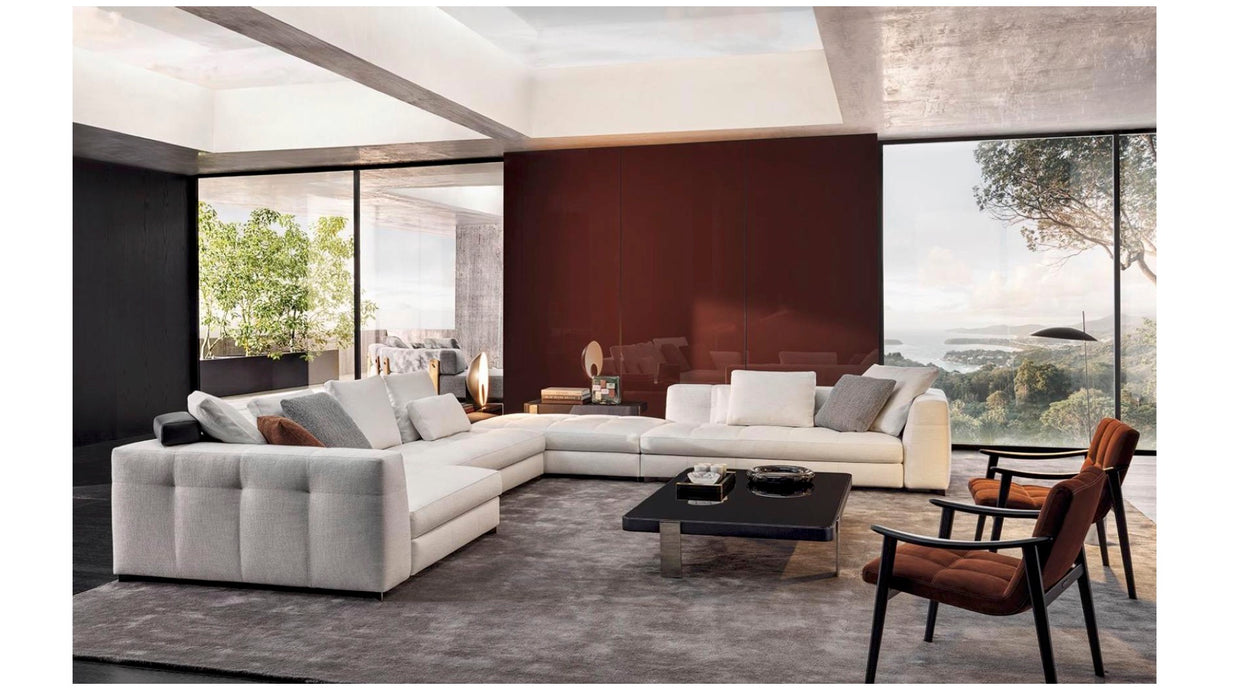 Modern living room with a sectional sofa, coffee table, and chairs.