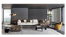 Modern living room with a sectional sofa, armchair, and coffee table.