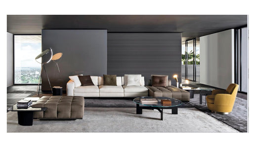 Modern living room with a sectional sofa, armchair, and coffee table.