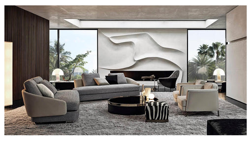 Modern living room with gray sofa, coffee table, and decorative items.